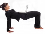 Woman doing Yoga at Work.